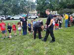 Sarasota Police officer with group of children